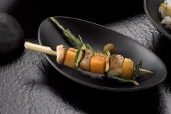 Plato ovalado negro melamina 18x10x3,5 cm -Pack 6 Ud.